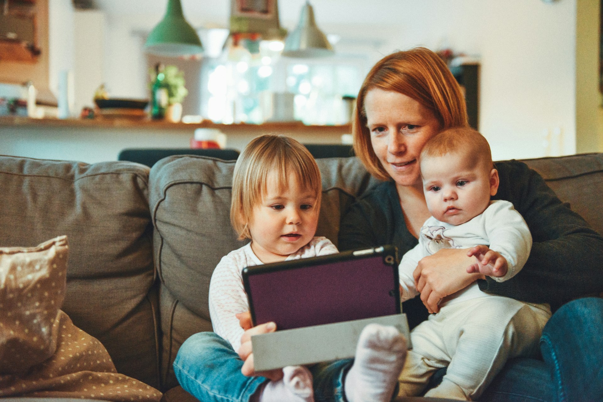 Parent with child using smartphone